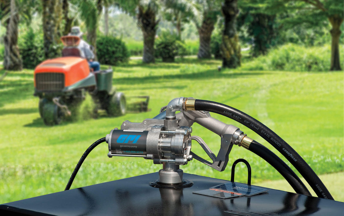 GPI EZ8 fuel transfer pump complete fueling system on fuel tank in front of a landscaping scene