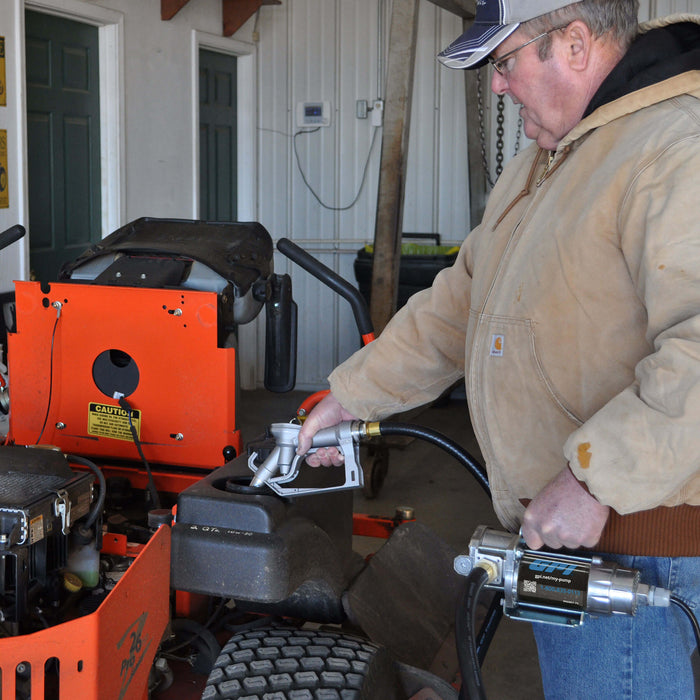 GPI G8P manual shut-off nozzle being used to refill a yard tractor by a farmer