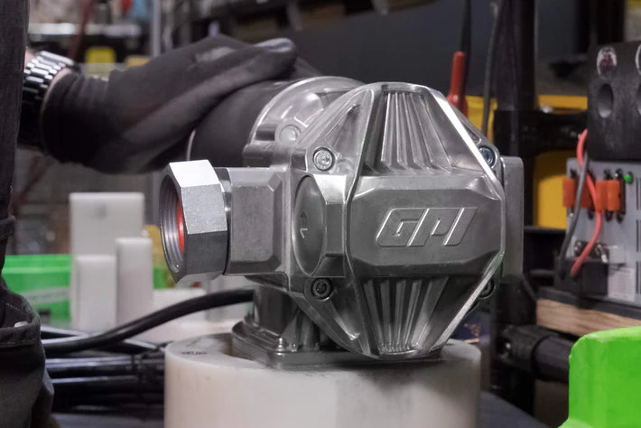 Close-up of a mechanical component with 'GPI' branding in an industrial setting