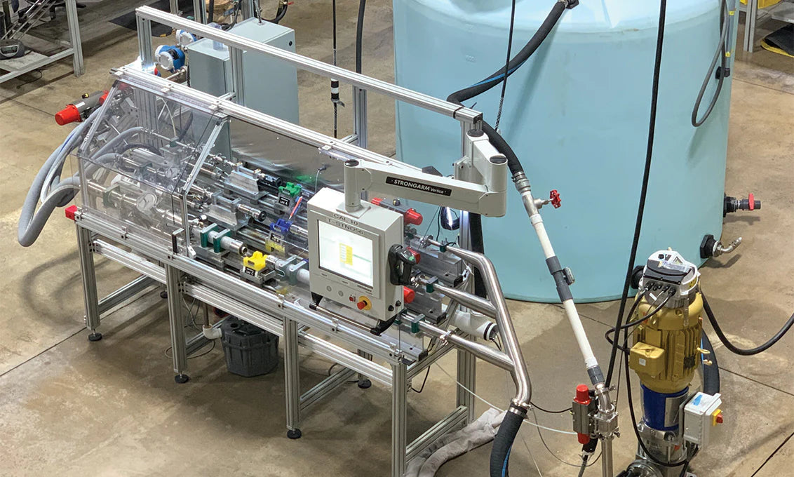 Industrial machine with various components on a concrete floor