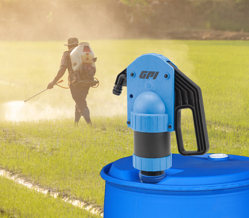 GPI LP-50 lever action hand pump mounted to a tank infront of someone spraying a field