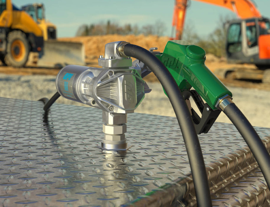 GPI G20 Fuel transfer pump with automatic shut-off diesel nozzle, fuel hose, and factory installed power cord on a tank at a construction site.
