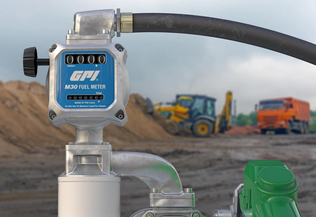 GPI M30-G8N 1 inch NPT Gallon measuring Fuel Meter in front of a construction site