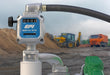 GPI M30-G8N 1 inch NPT Gallon measuring Fuel Meter in front of a construction site