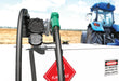 GPRO V25 fuel transfer pump with automatic nozzle on a fuel tank by a blue tractor on a grain field